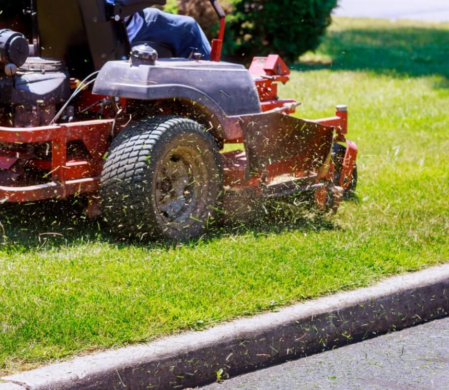 mowing a lawn in a rider mower